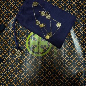Tory Burch gold necklace ( with blue dust bag )